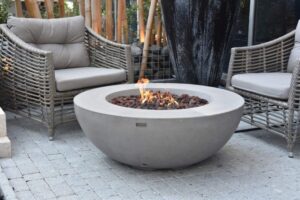 airbnb backyard area with chairs and fire pit